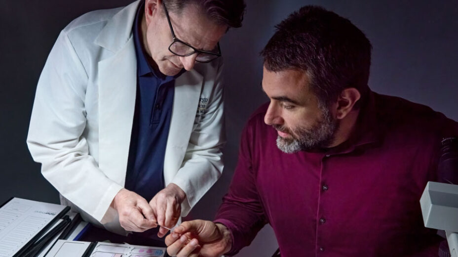 Doctors using a microscope to examine specimens