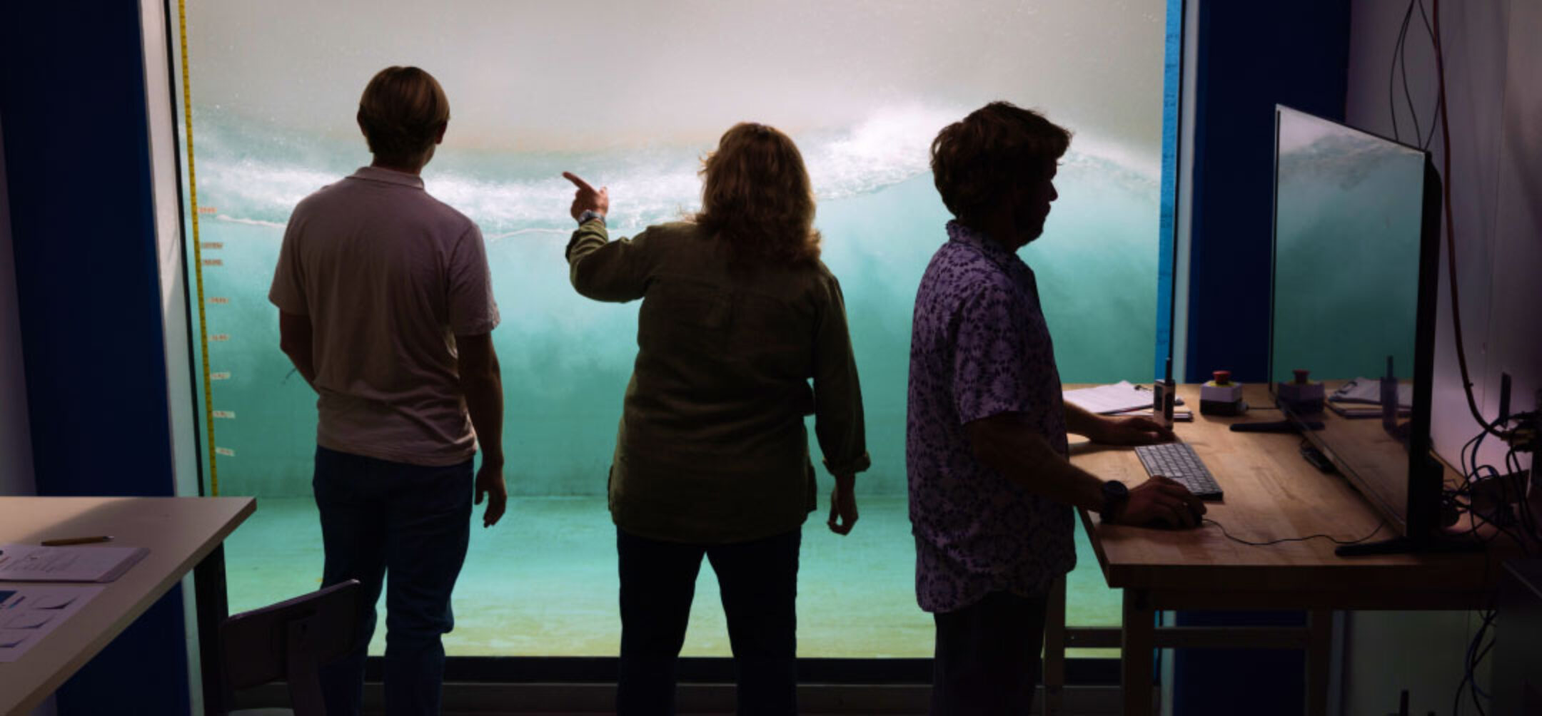 Three scientists reviewing findings