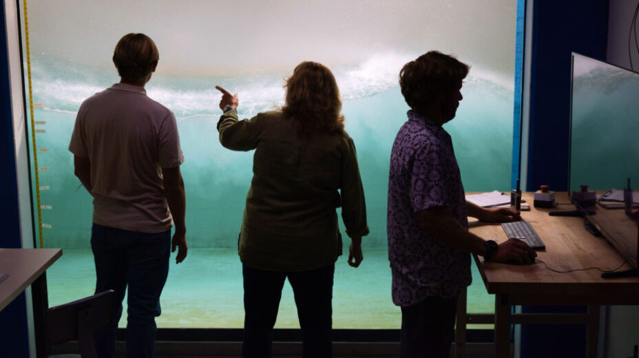 Three scientists reviewing findings