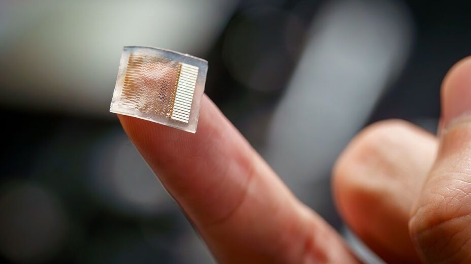 Wearable computerized patch balanced on the tip of a man's finger