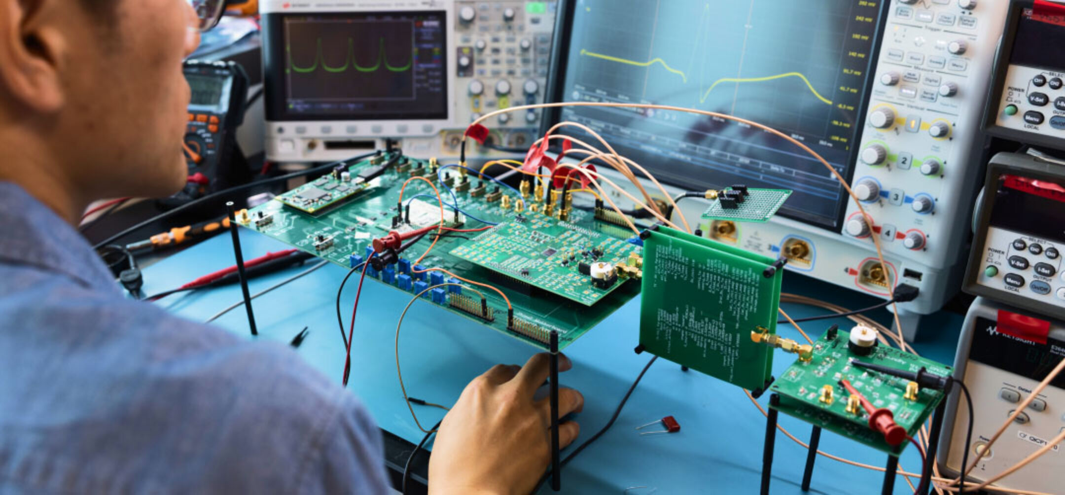 Man working with electronics and motherboards