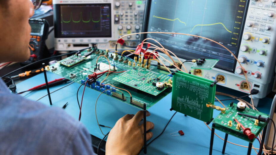 Man working with electronics and motherboards