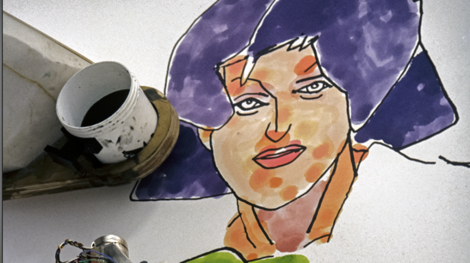 An automated device shown adding color to a piece of artwork created entirely by AI
