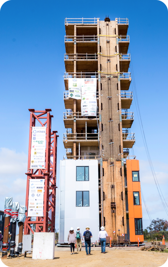 Building under construction - first three floors have exterior walls and windows while the remaining floors are incomplete.