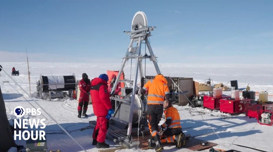 Scientists take an ice core sample.